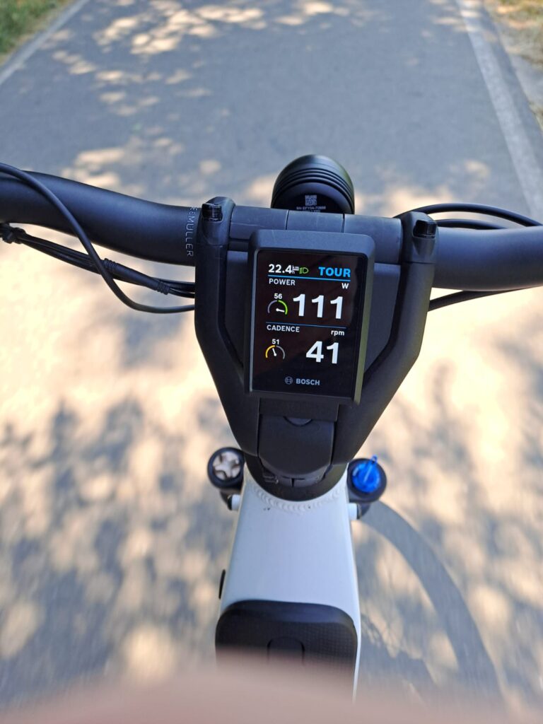 A bike computer showing a speed of 22.4 km/h and a cadence of 41 rpm.